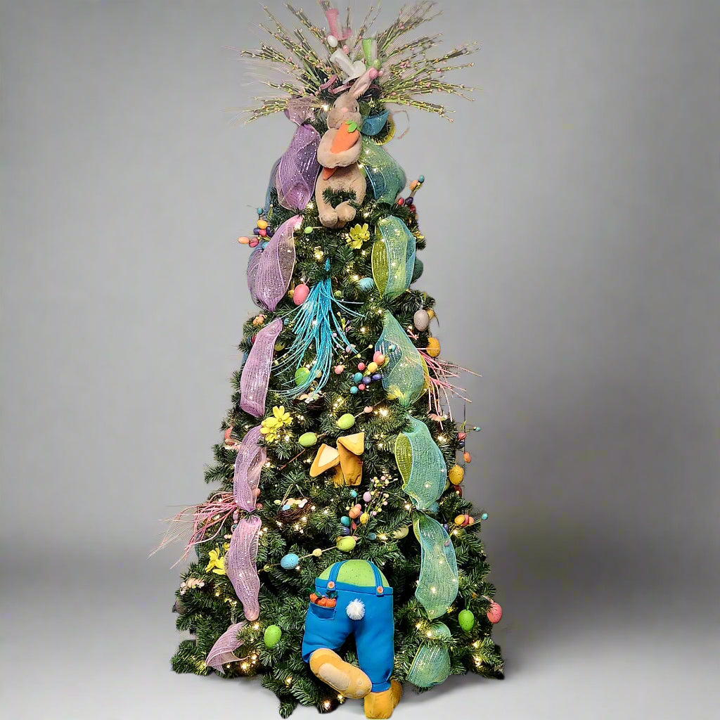 Colorful Christmas tree decorated with various ornaments in a room.