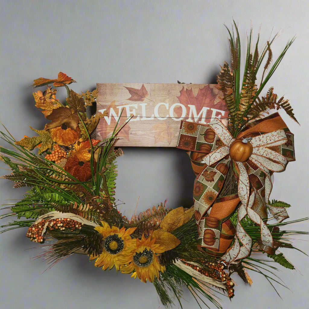 Autumn-themed  grapevine wreath with sunflowers and pumpkins